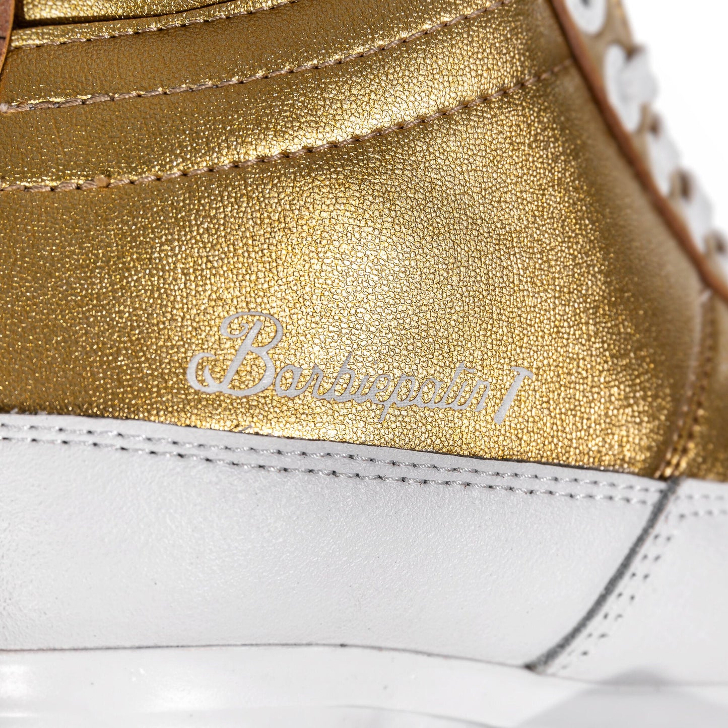 Close-up of the Barbiepatin logo on the Chaya Kismet skate, highlighting its distinctive design.