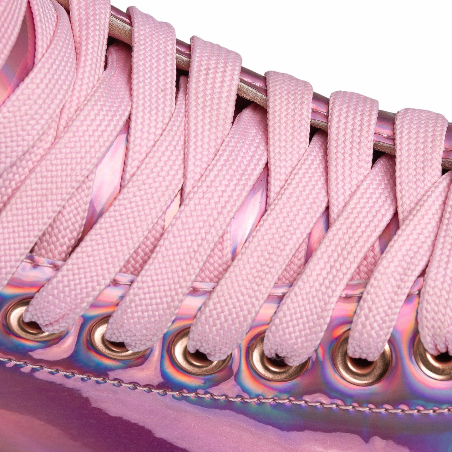 Close-up on the laces of a Chaya Melrose Elite Space Holographic skate, showing their secure arrangement against the iridescent boot.