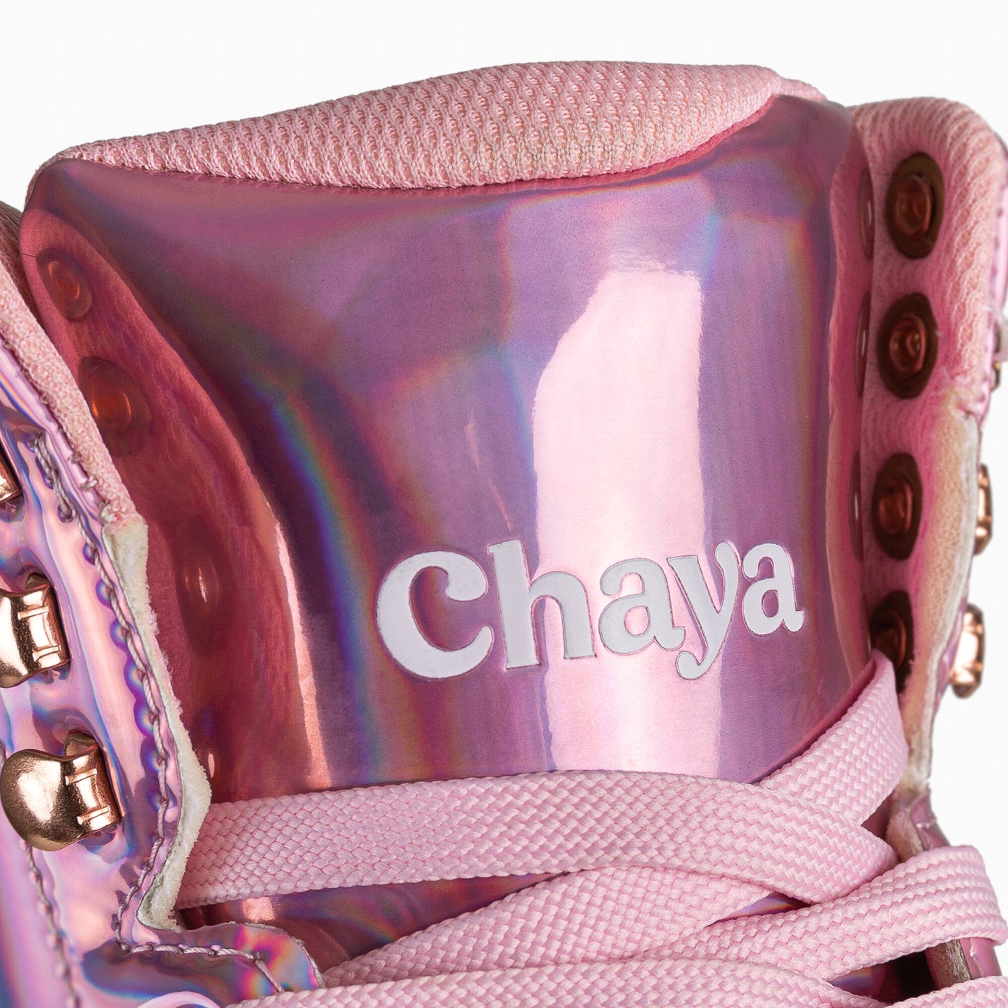 Close-up of the tongue on the Chaya Melrose Elite Space Holographic skate, highlighting its iridescent material and supportive padding.