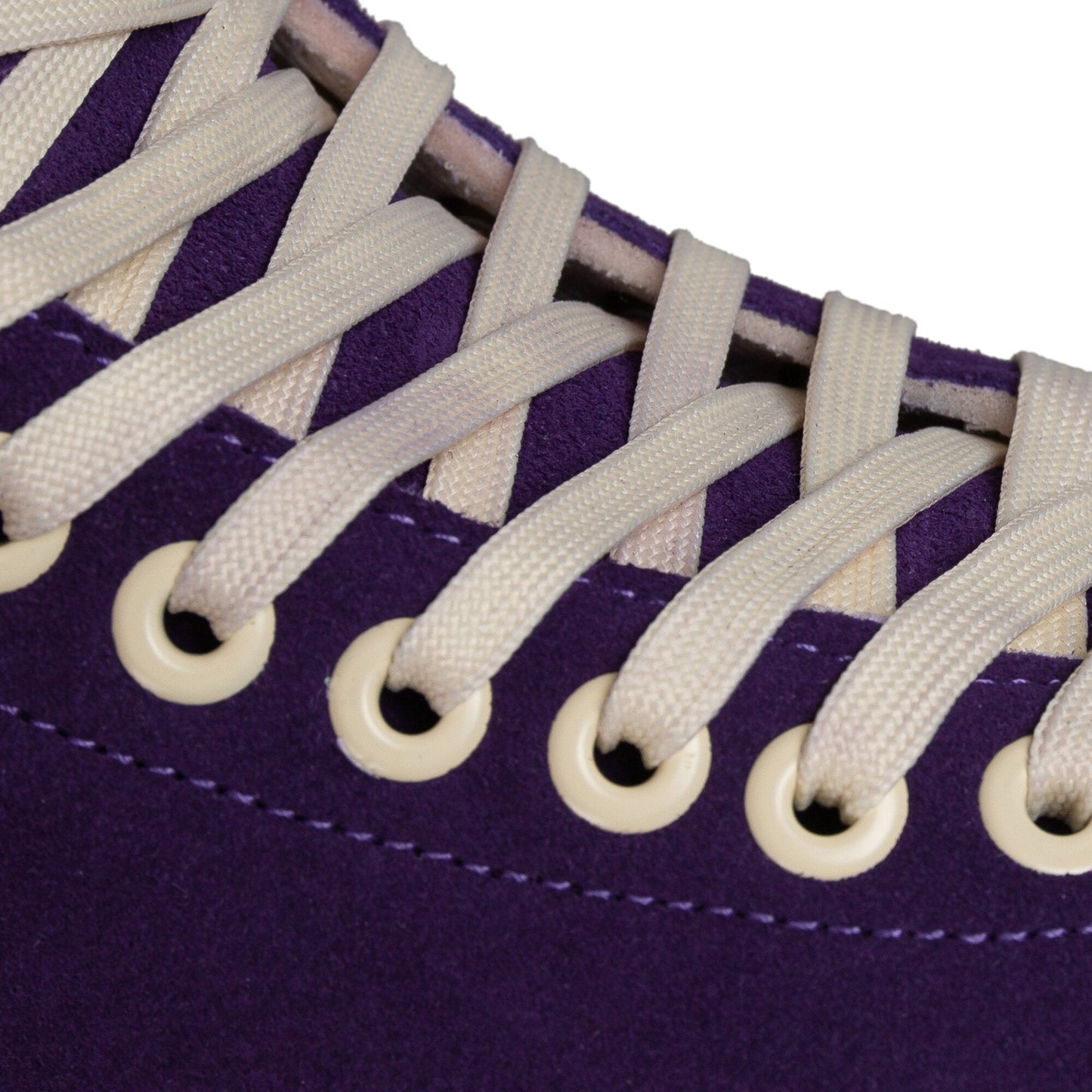 Close-up on the laces of a Chaya Melrose Elite Purple Evil skate, showing their secure arrangement against the dark boot.
