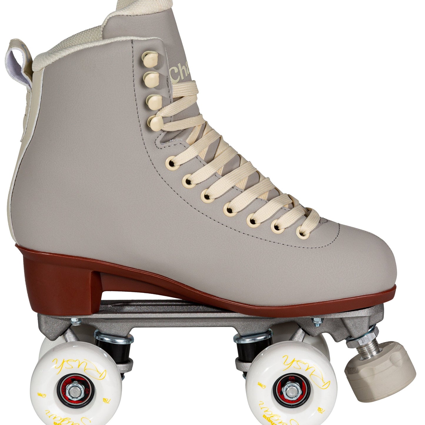 View of a Chaya Melrose Deluxe Latte quad skate from the side, showcasing its full boot, wheel, and plate assembly in the signature latte color.