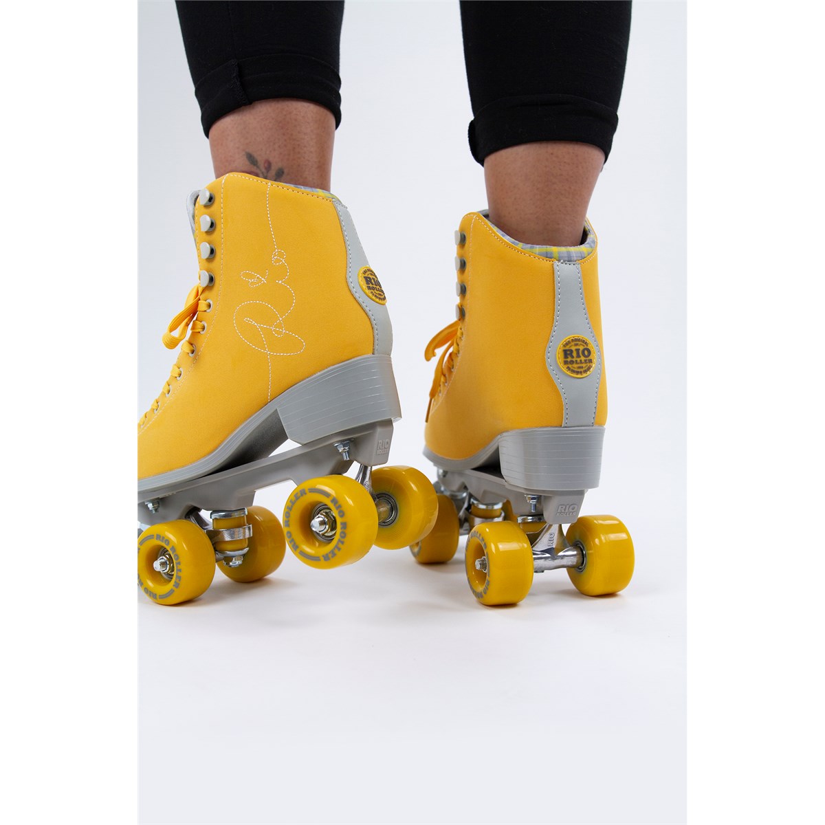 Person wearing Rio Roller Signature Yellow skates in studio