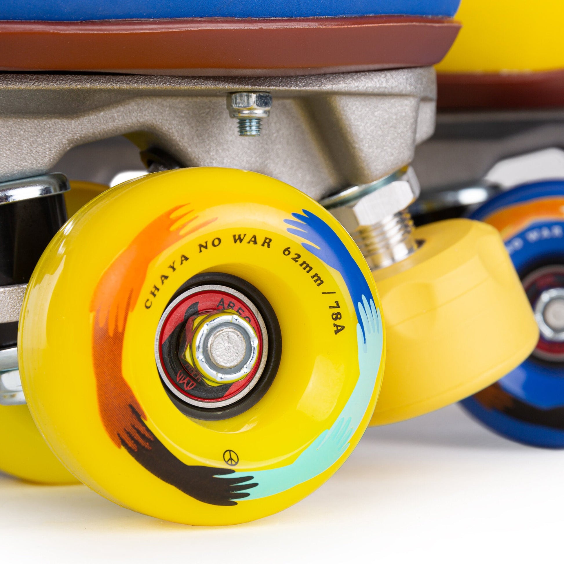 Close-up of a wheel on a Chaya Deluxe NO WAR skate, highlighting its design and smooth finish.