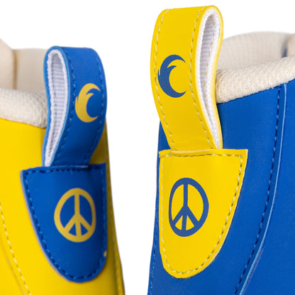 Close-up of peace symbols and anti-war graphics prominently displayed on the Chaya Deluxe NO WAR roller skate boot.