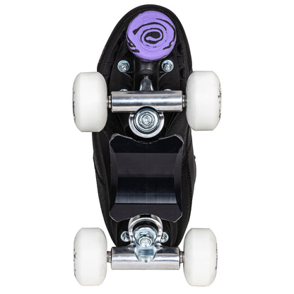 Underside view of a Chaya Kismet Barbiepatin Black skate, detailing the plate, trucks, and toe stop.