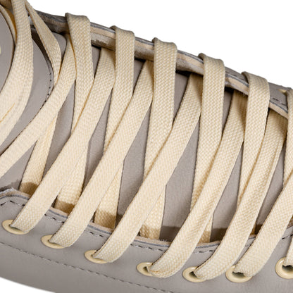 Detailed shot of the laces on a Chaya Melrose Deluxe Latte skate, showing their secure fit and harmonious color.