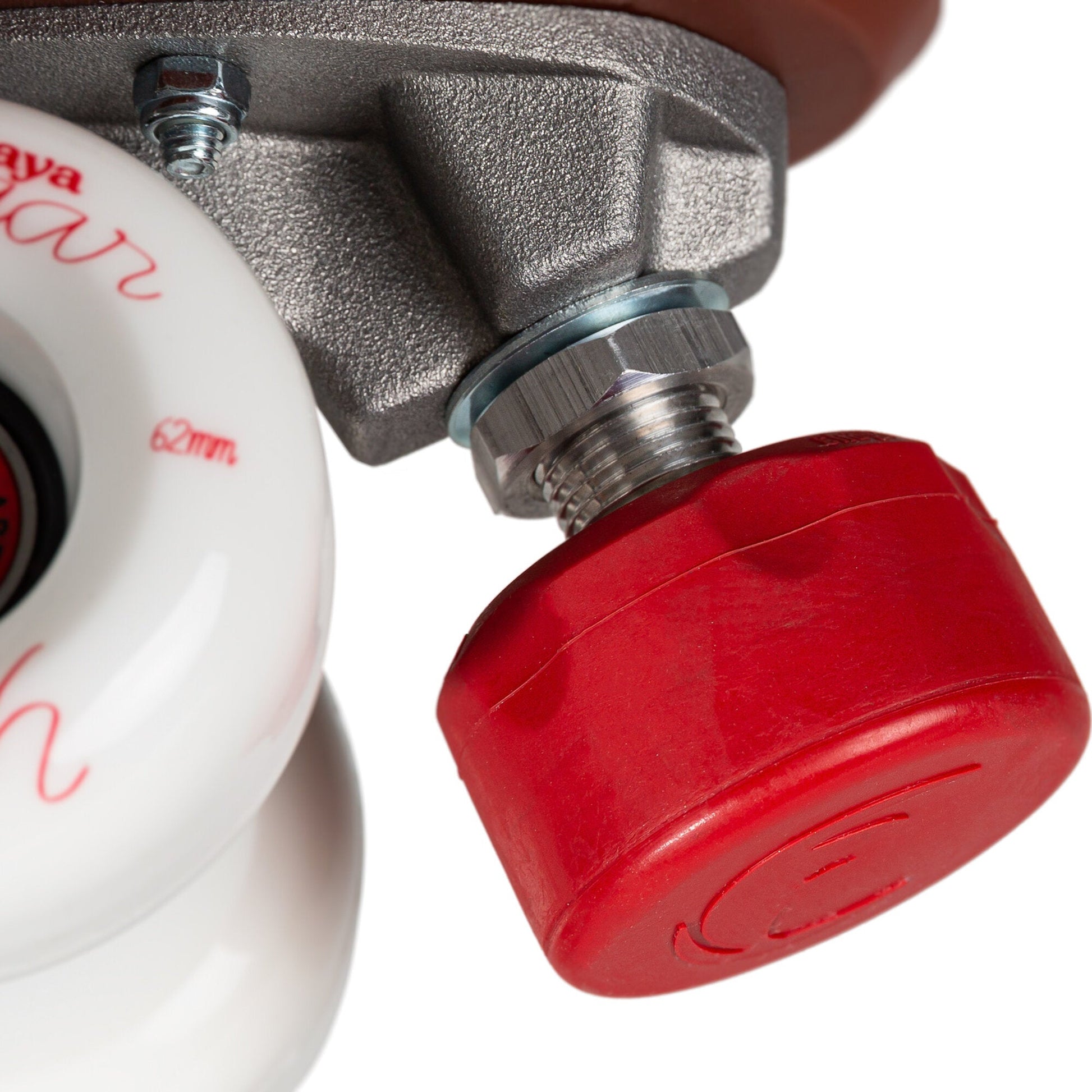 Close-up of the ruby-red toe stop on a Chaya Melrose Deluxe Ruby skate, highlighting its material and position.