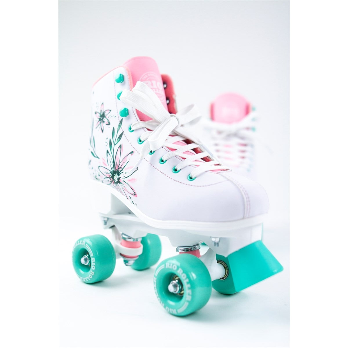 Artistic studio shot of the Rio Roller Artist skates on a clean white background, emphasizing their striking colors and unique pattern.
