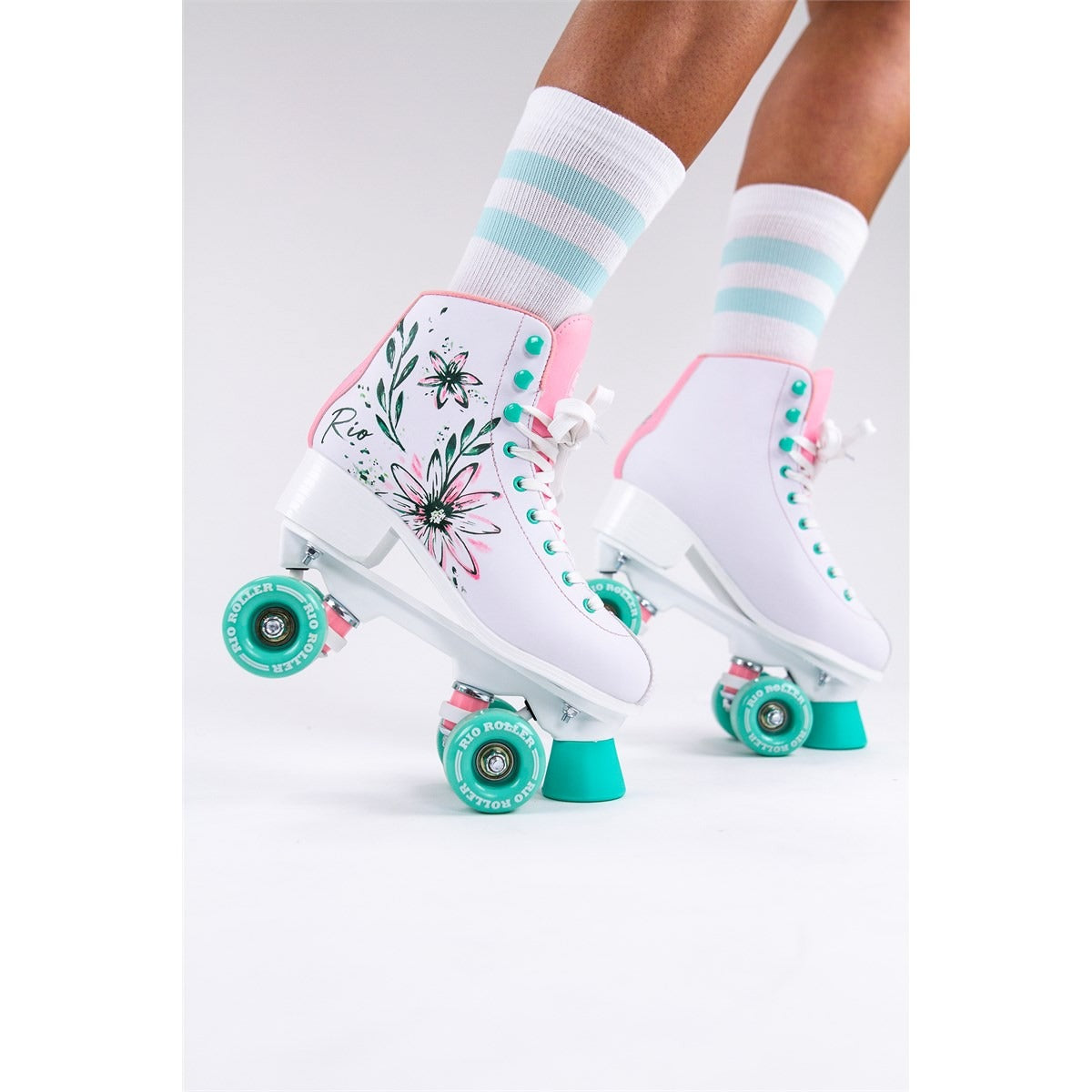 Conceptual photo of the Rio Roller Artist skates on a seamless white backdrop, focusing on their stylish shape and vibrant branding.